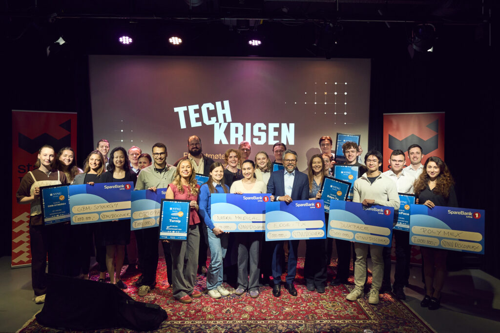 All the recipients of the main project funds on stage, each with their own check and diploma.